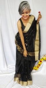 Chanchal, beautiful, party wear, festive wear, black, handloom, Chanderi silk cotton saree with silver golden traditional round zari butas, elegant pallu with flower shaped buta in silver and golden zari.