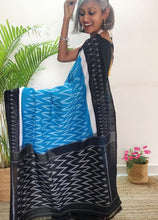 Load image into Gallery viewer, Chanchal, beautiful Ikkat soft cotton saree, blue color with white chevron patterns, black border with motifs, black pallu chevron pattern, office wear, handwoven, casual wear.
