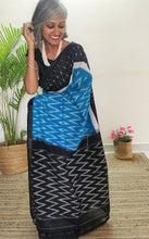 Load image into Gallery viewer, Chanchal, beautiful Ikat cotton saree, blue color with white chevron patterns, black border with motifs, black pallu chevron pattern, office wear, handwoven, casual wear.