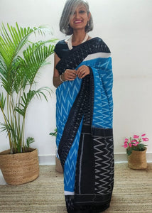 Chanchal, beautiful Ikat cotton sari, blue color with white chevron patterns, black border with motifs, black pallu chevron pattern, office wear, handwoven, casual wear.