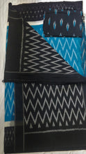 Load image into Gallery viewer, Chanchal, beautiful Ikkat soft cotton saree, blue color with white chevron patterns, black border with motifs, black pallu chevron pattern, office wear, handwoven, casual wear.
