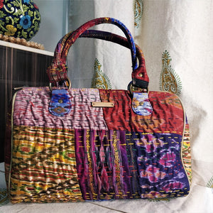 Beautiful purple golden multicolor Kantha Ikat handcrafted silk duffle bag I Chanchal bringing art to life 