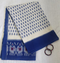 Load image into Gallery viewer, White and Blue Ikat soft Cotton Saree, gorgeous. elegant, handloom, festive wear, Durga puja, Ganapati, office wear, ethnic collection, traditional dress, Chanchal bringing art to life. 