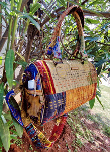 gorgeous golden orange multicolor Kantha Ikat handcrafted silk duffle bag I Chanchal bringing art to life 