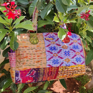 Classy sky golden multicolor Kantha Ikat handcrafted silk duffle bag I Chanchal bringing art to life 